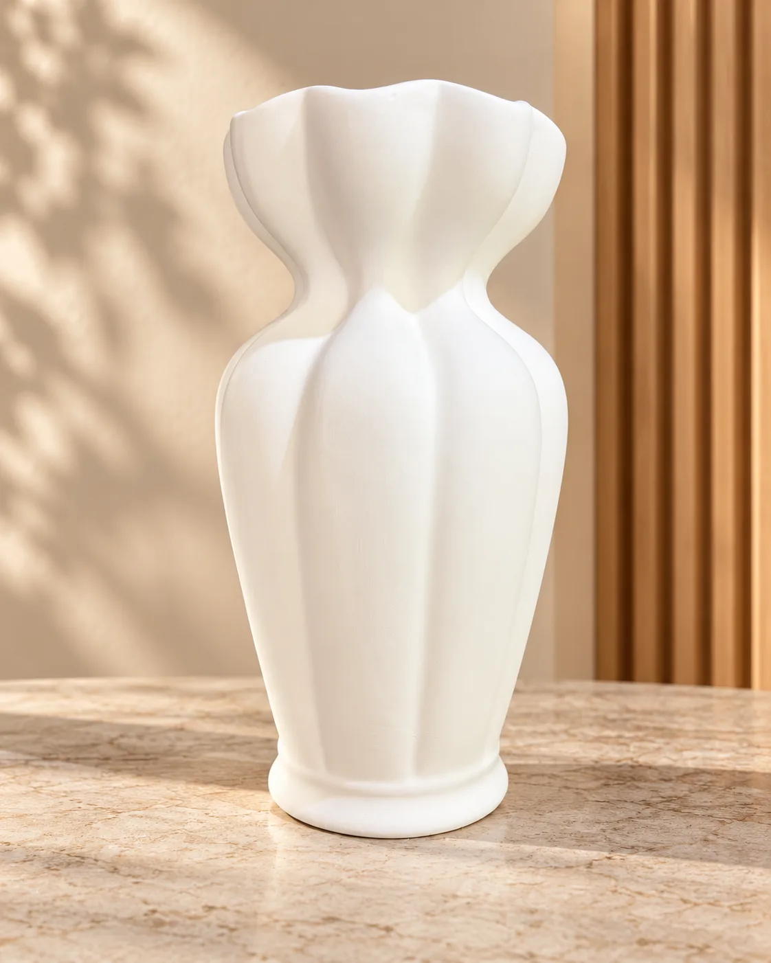 White decorative vase with a modern wavy and sculptural design
